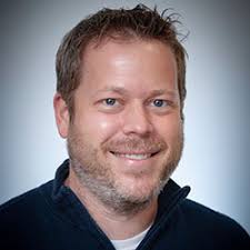 A picture of a light skinned man with brown hair